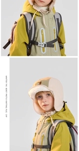 Detail of kids winter trapper hat featuring fleece lining and chin strap buckle