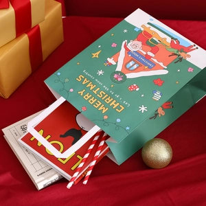 Christmas gift bag with Santa and reindeer on green background with red velvet props