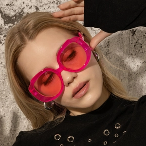 Fashionable oversized round frame sunglasses in transparent hot pink for trendy street style