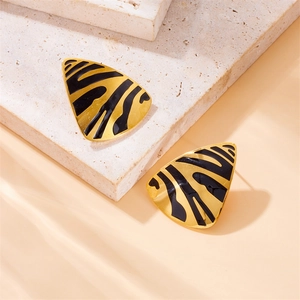 Triangle geometric stud earrings with gold and black zebra pattern on stone base
