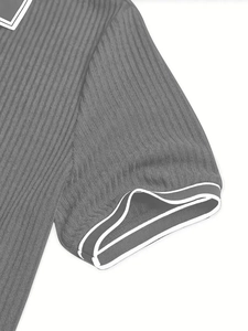 Detailed view of grey short-sleeve Polo shirt with white ribbed cuffs and texture