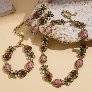 Vintage Baroque jewelry set with gold cameo heart necklace and floral earrings