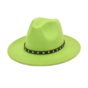 Close-up of neon green fedora hat with silver studded leather belt and wool texture