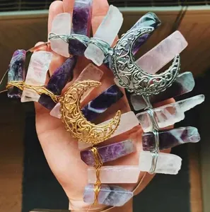 Detail of handcrafted bohemian headband with amethyst crystals and gold moon charm