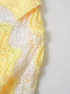 Close-up of yellow and white wave striped knit fabric showing texture and soft material