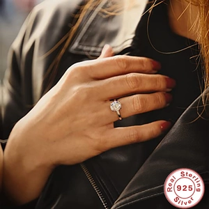 Close-up of a 925 sterling silver solitaire diamond ring worn on a model's hand
