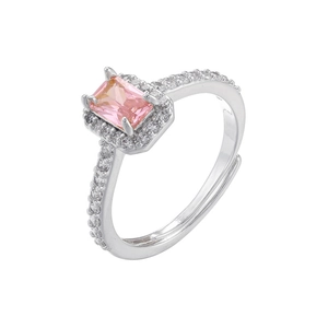 Macro detail of rectangle pink gemstone ring with 4-prong setting and pavé side stones