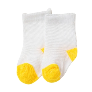 Detailed close-up of 18-inch doll socks in white and yellow knitted cotton fabric