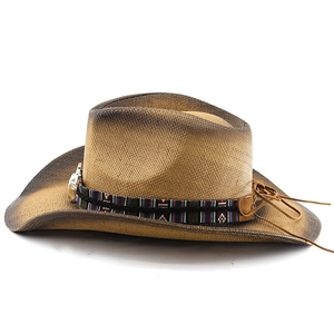Detailed texture of western straw hat with ethnic band and vintage metal buckle detail