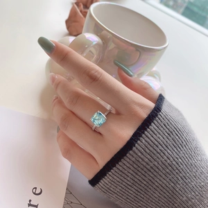 Detail shot of a square light blue zircon stone set on a slim S925 sterling silver ring