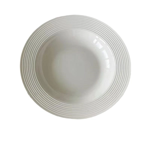 Minimalist white ceramic pasta plate with textured wide rim for elegant dining