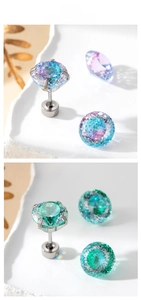 Detail view of 6-8mm gradient cubic zirconia bird nest earrings with steel screw backs