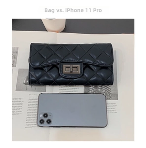 Quilted leather wallet size comparison featuring a classic metal lock and iPhone 11 Pro