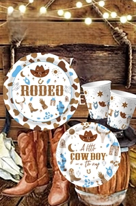 Detail view of Western Cowboy theme party supplies including rodeo paper plates and cups