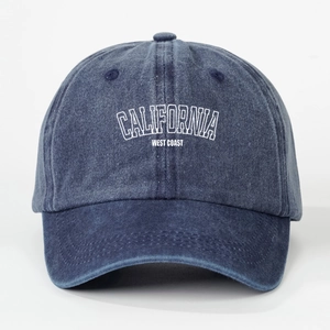 Detail of navy blue washed cotton baseball cap with white CALIFORNIA embroidery