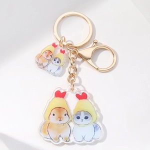 Cute acrylic keychain featuring small animals with yellow hats and golden lobster clasp