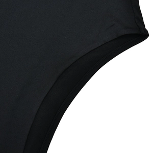 Detailed close-up of double-stitched edge on black high-density elastic fabric garment