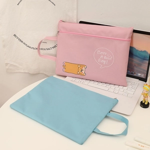 Detail of pink cartoon shiba inu A4 file bag with zipper and portable handle strap