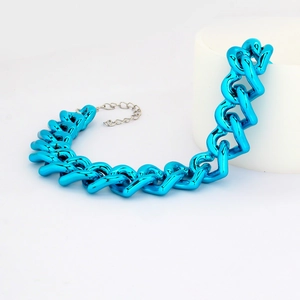 Detail of a bright blue chunky hip hop pet chain with metallic finish and lobster clasp