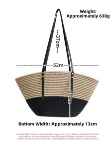 Detail view of woven straw tote bag with dimensions: 52cm width and 26cm height