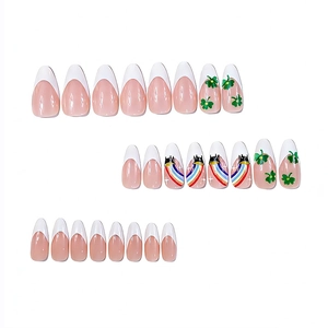 Glossy almond press-on nails with St. Patrick's shamrock and rainbow french designs