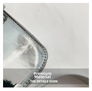 Detailed macro view of the silver metallic mirror leather finish and fine stitching craftsmanship
