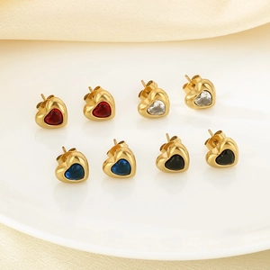 Set of 4 pairs of gold heart stud earrings with red blue black and clear gems