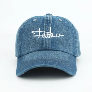 Classic blue denim baseball cap with white cursive embroidery and vintage washed texture