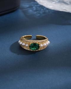 Elegant gold open ring featuring emerald gemstone, pearls and sparkling zircons