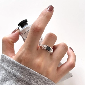 Minimalist S925 sterling silver ring with rectangular black gemstone on model hand