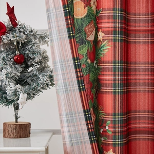 Christmas themed blackout curtain featuring red tartan pattern and holiday border prints