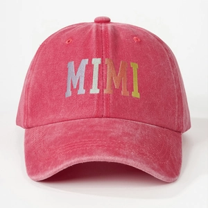 Close-up of MIMI colorful embroidery on rose red washed cotton baseball cap