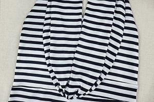 Detailed view of the black and white horizontal stripe pattern on elastic knitted fabric