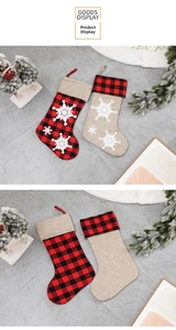 Detailed view of red plaid and burlap Christmas stockings with 3D white snowflake embroidery