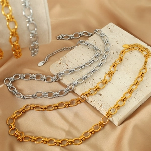 Elegant gold and silver titanium steel link bracelets displayed on stone and satin background