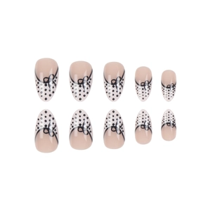 French style almond press-on nails with black polka dots and sweet bow designs