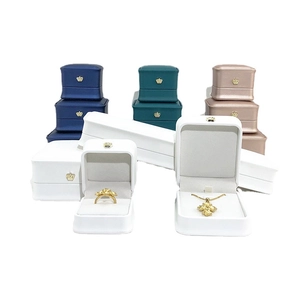 Elegant PU leather jewelry box set with crown logo in blue, green, and gold colors