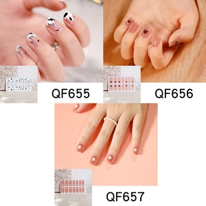 Detailed nail sticker sets featuring cow print, hearts, and daisies for DIY nail art designs