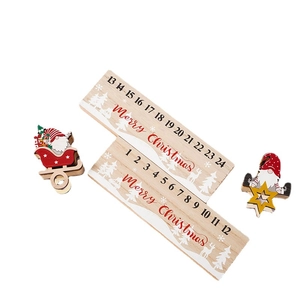 Wooden Christmas countdown calendar blocks with Santa figures and Merry Christmas text