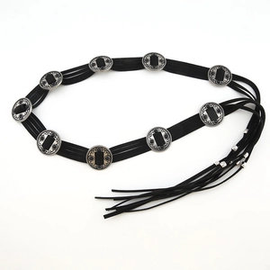 Detail view of Bohemian black multi-strand waist chain with silver vintage discs and tassels