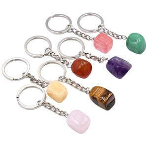Set of seven irregular natural crystal and agate stone keychains in various vibrant colors