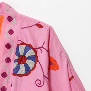 Loose pink embroidered cardigan jacket for women featuring colorful floral patterns