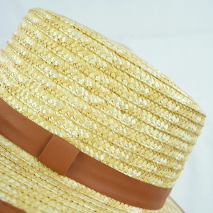 Vintage khaki straw hat with brown leather band for sun protection and beach style