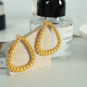 Elegant gold twisted teardrop earrings with a textured geometric design for women
