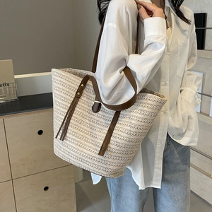 Large straw tote bag for women with leather straps and woven texture for summer beach