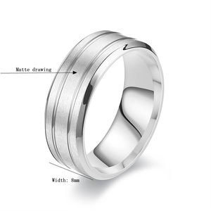 Detail of 8mm matte brushed titanium steel ring with polished edges and double grooves
