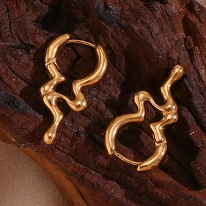 Irregular liquid style earrings in 18K gold plated stainless steel on wood