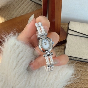 Vintage oval pearl watch for women with silver mother-of-pearl dial and pearl strap