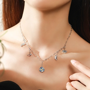 Elegant s925 silver necklace featuring colorful enamel butterfly and floral pendants on model
