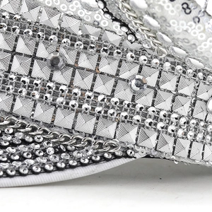 Sparkly silver sequin captain hat with metallic studs and chains for festival parties
